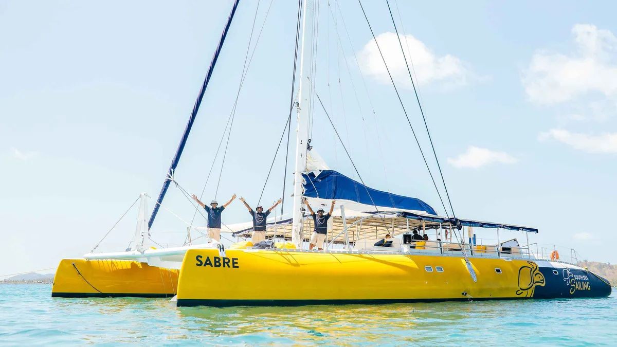 Sailing catamaran anchored over turquoise water on a full-day Mamanuca Islands tour from Port Denarau, Fiji